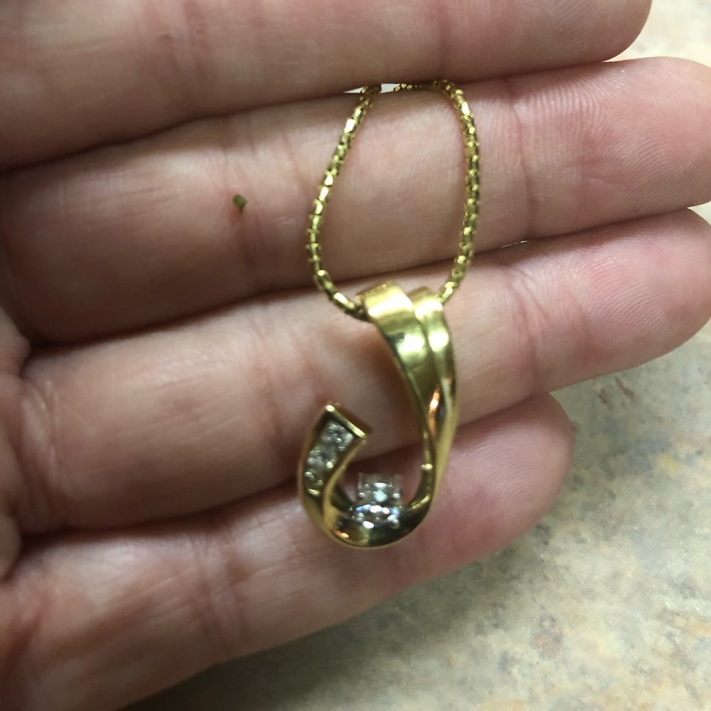 Gold and diamond tear drop necklace.